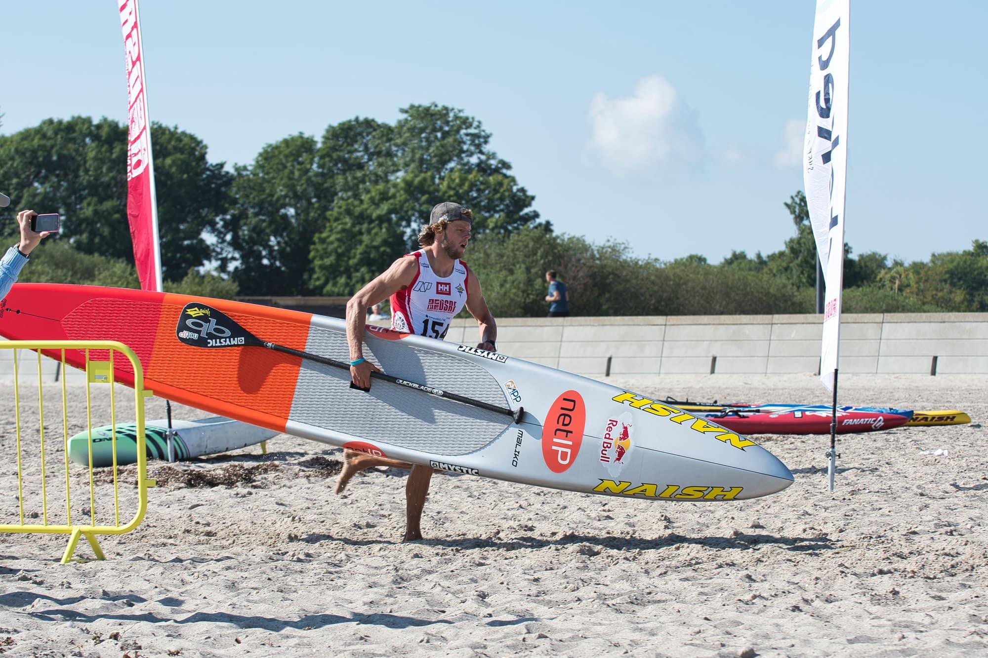 Casper Steinfath Gets Gold Medal Hat Trick at Danish SUP Championships - Naish.com